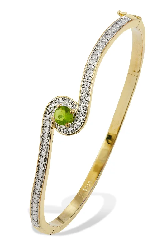 Celebrate Every Occasion With Sparkling Savings BIRTHSTONE TWO-TONE GOLD PLATED CZ BANGLE BRACELET Celebrate Every Occasion With Sparkling Savings BIRTHSTONE TWO-TONE GOLD PLATED CZ BANGLE BRACELET