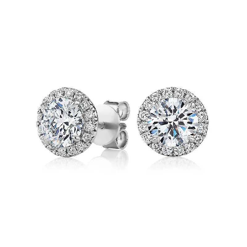 Exclusive Savings On Timeless Jewelry Pieces Signature Simulant Diamond 2.35 carat* TW round brilliant halo earrings in 10 carat white gold Exclusive Savings On Timeless Jewelry Pieces Signature Simulant Diamond 2.35 carat* TW round brilliant halo earrings in 10 carat white gold